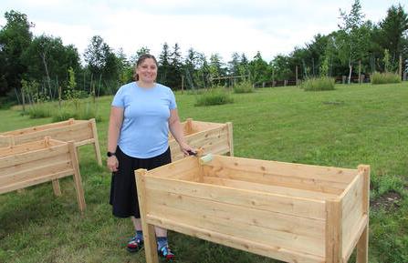  Taralyn Bielaski, MPH standing at the Farmacy Garden